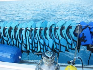 Lifejackets on the rail for sailing in Cuba, by Yvonne Gordon